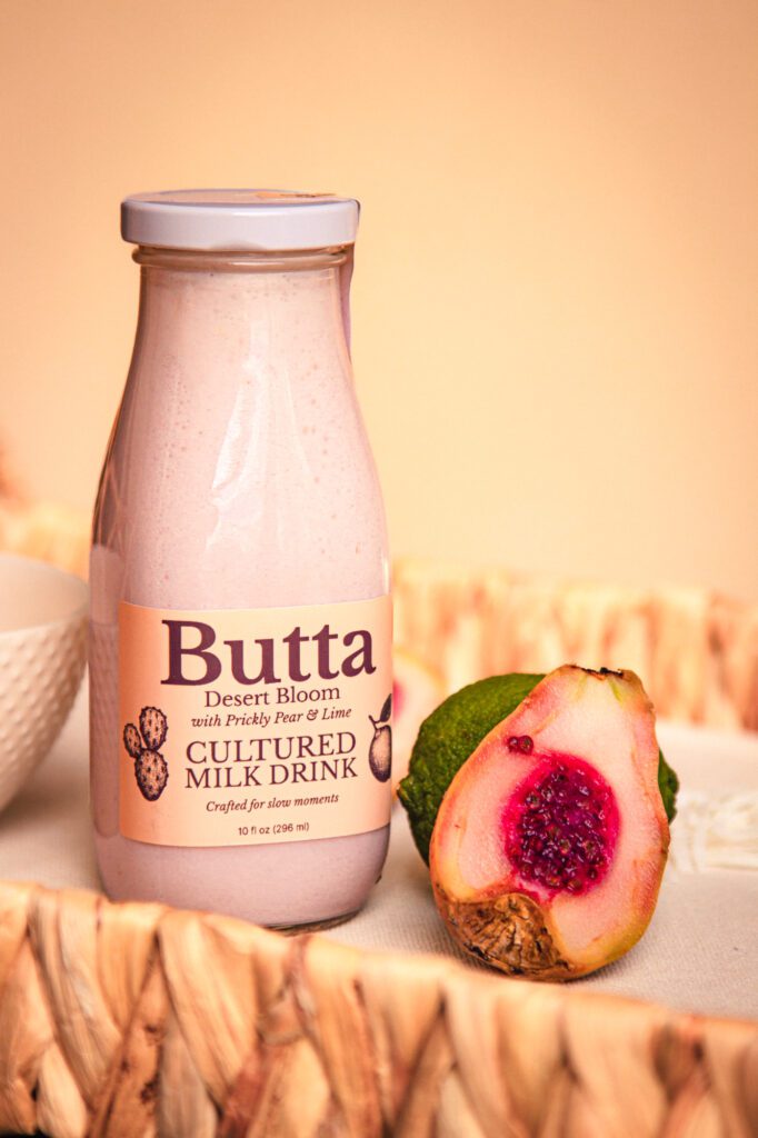 Butta Desert Bloom cultured milk drink with prickly pear and lime in desert light