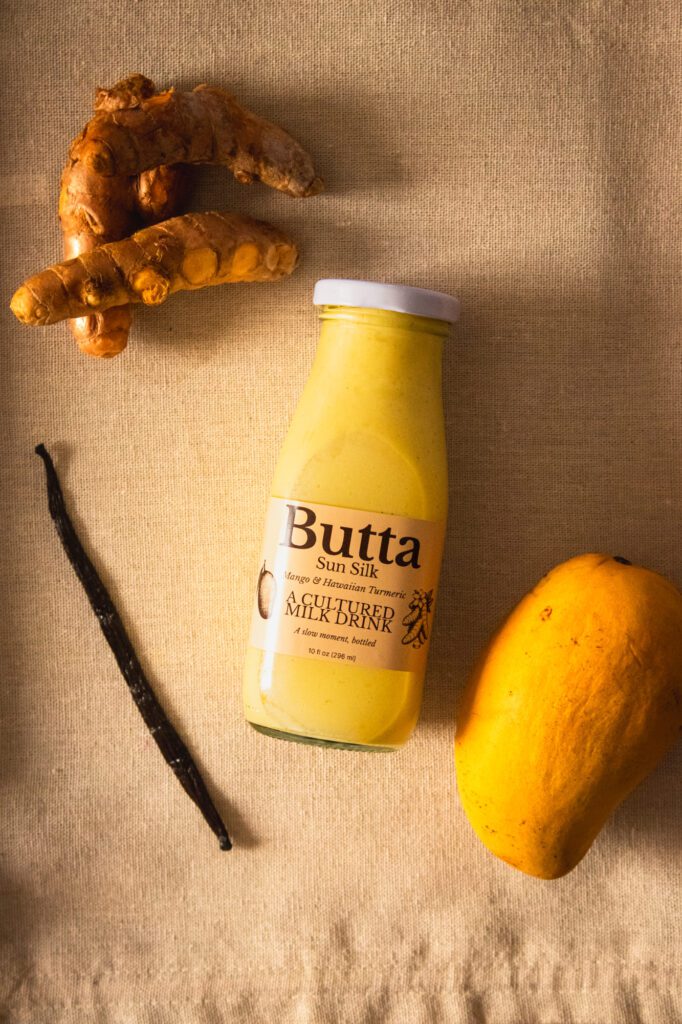 Sun Silk cultured milk drink with mango, Hawaiian turmeric and vanilla flatlay